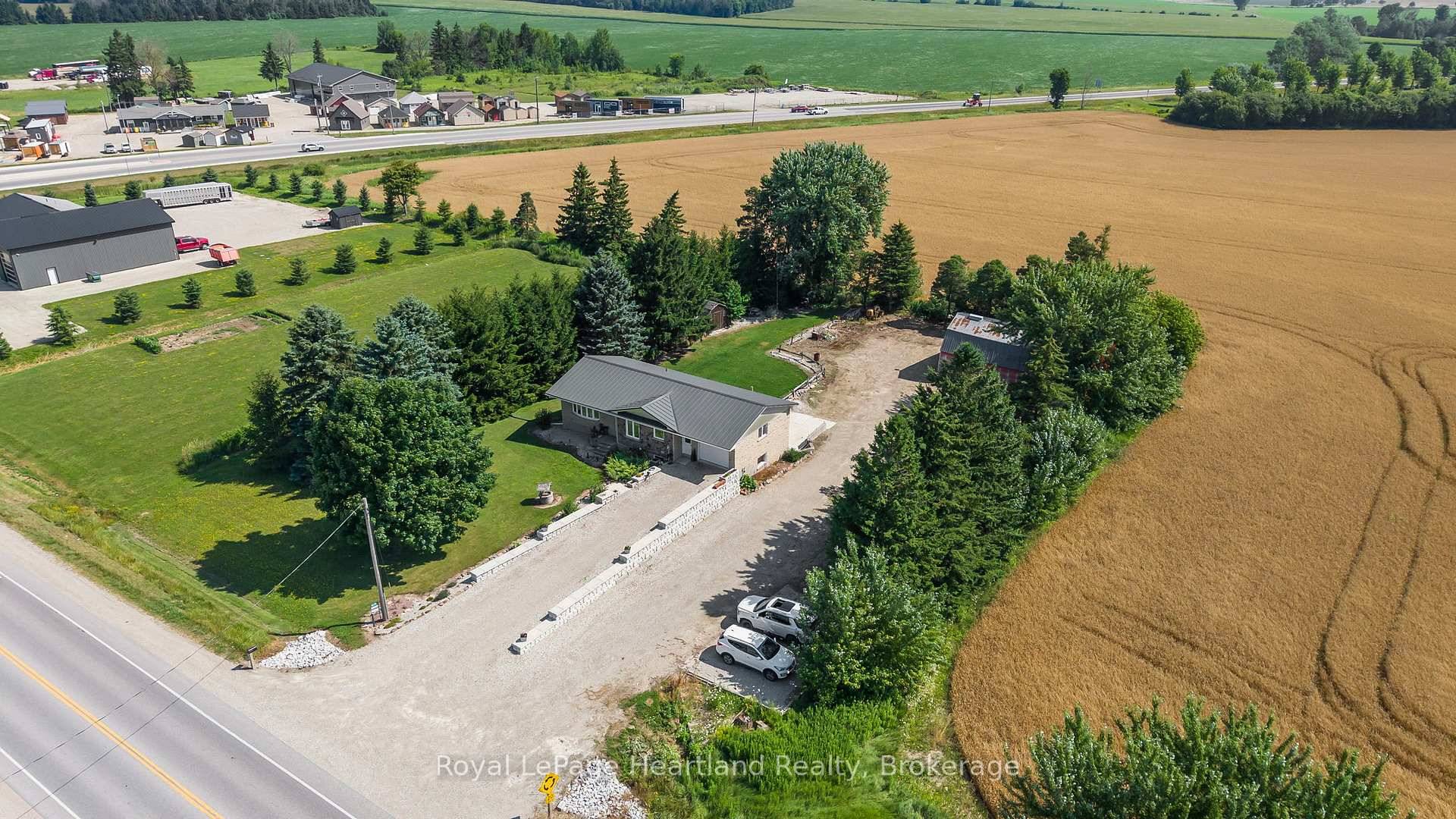 Here is the best of BOTH worlds a private and secluded backyard country oasis WITH highway frontage exposure for advertising, business or simply people watching.