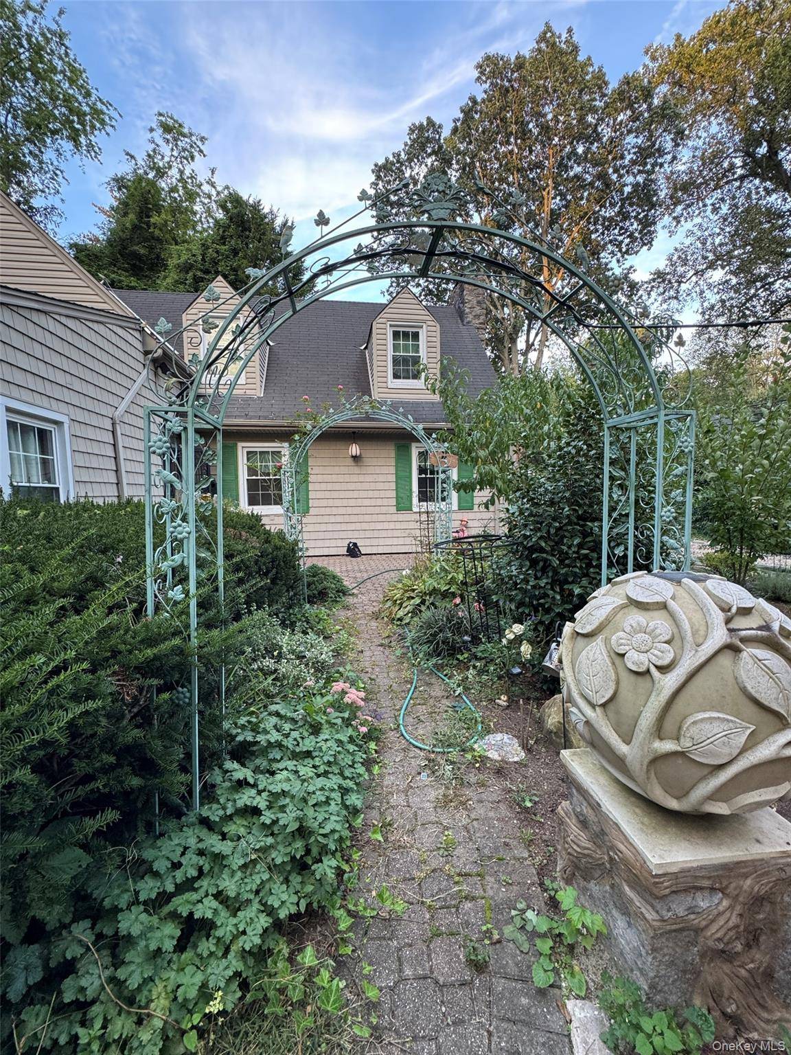 Fully renovated 2023, move in ready garden SFH with sunroom.