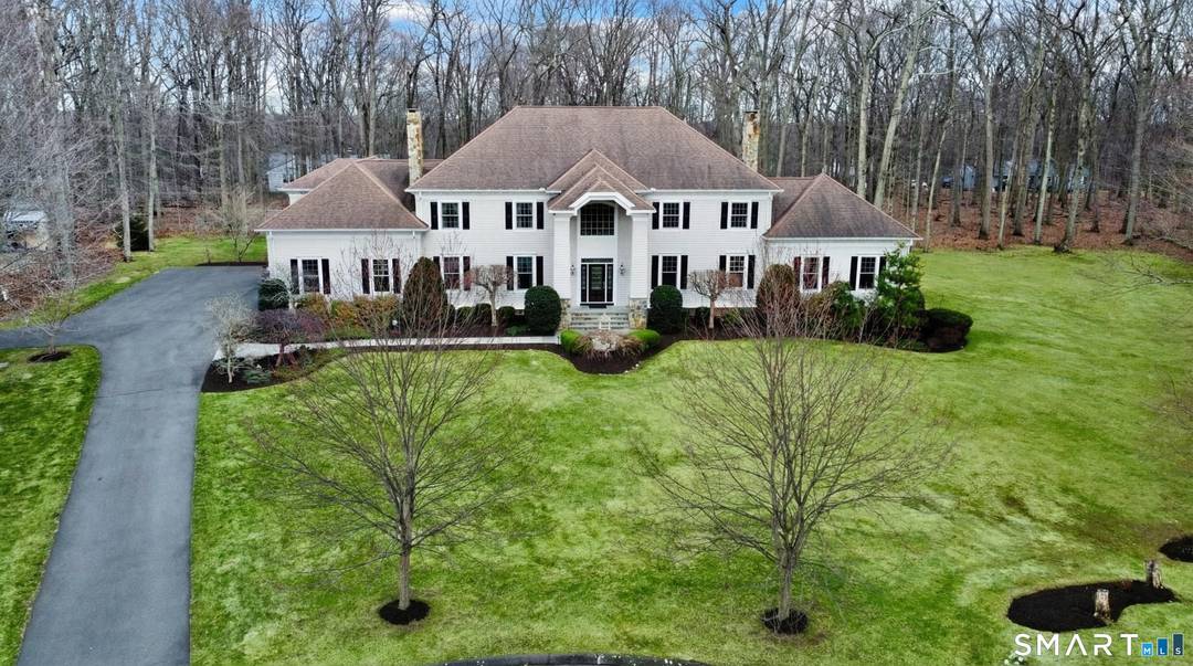 Set at the end of a tranquil cul de sac, this distinguished 4 bedroom, 6 bath Colonial offers refined elegance, exceptional craftsmanship, and a rare sense of privacy.