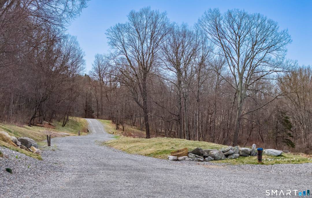 A striking blend of modern design and timeless barn inspired architecture, this exceptional 4, 250 SF home sits privately on 12.