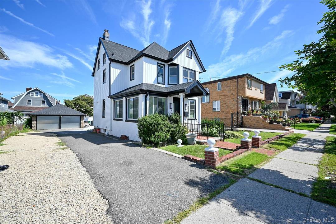 This completely renovated enormous sun drenched south facing single family home is located in the heart of Beechhurst on an extra wide 6000 sq ft lot.