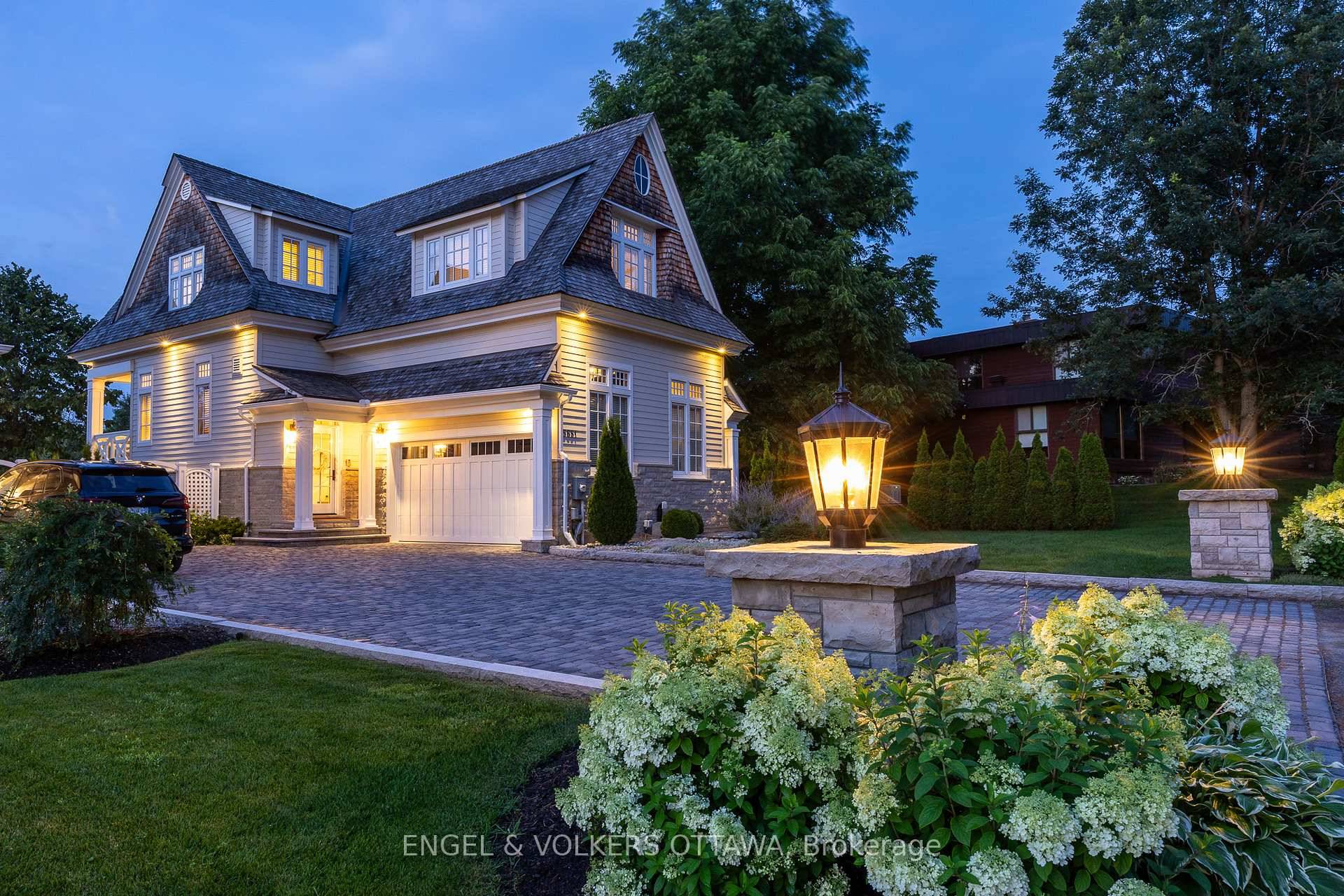Imagine an architectural waterfront masterpiece nestled in the heart of Manotick, seamlessly blending timeless design with modern luxury.