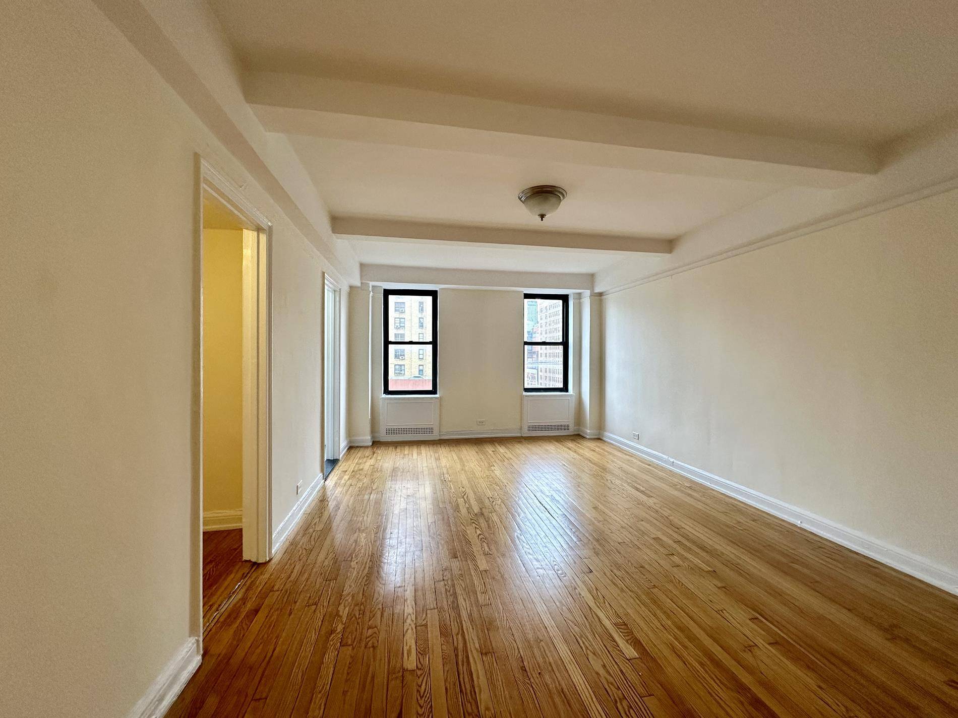 Come see this LARGE studio with great light and amazing city views, Large walk in closet and a separate nook off the bathroom for a desk dressing area.