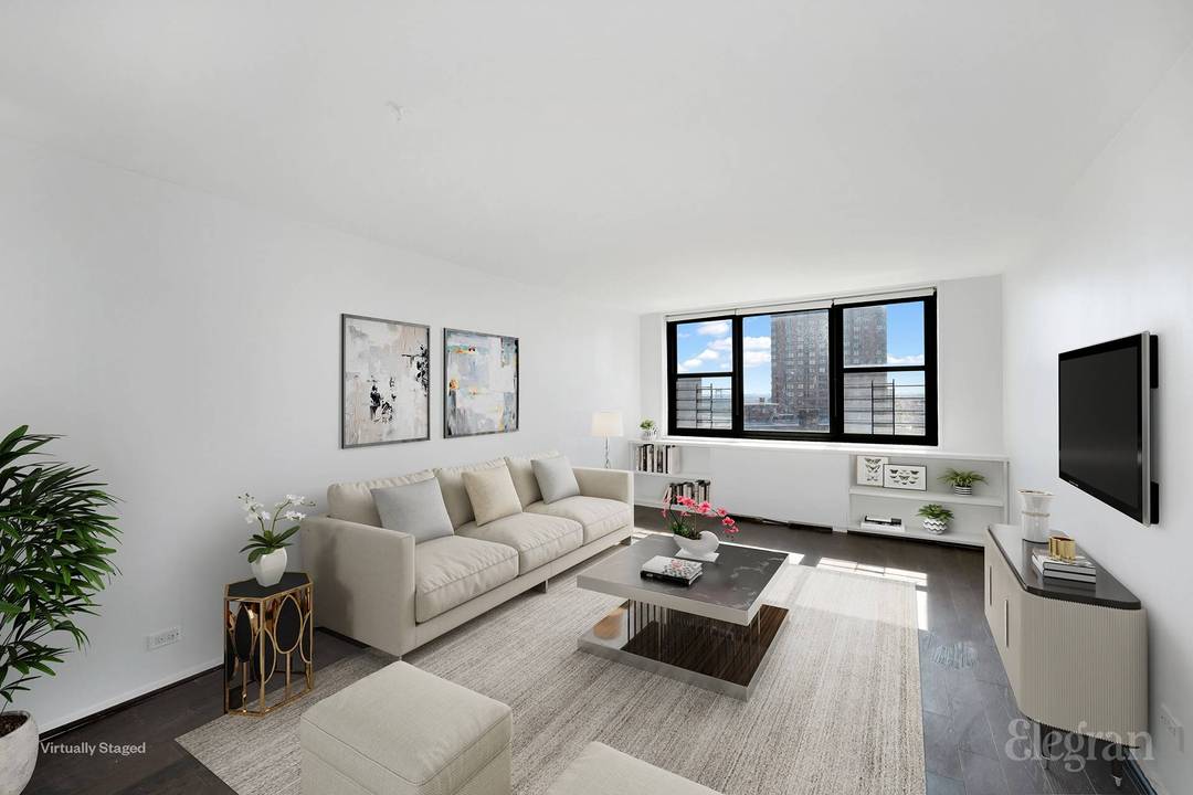This top floor corner one bedroom, one bathroom home spans 677 square feet and offers open views of the East River and downtown skyline.