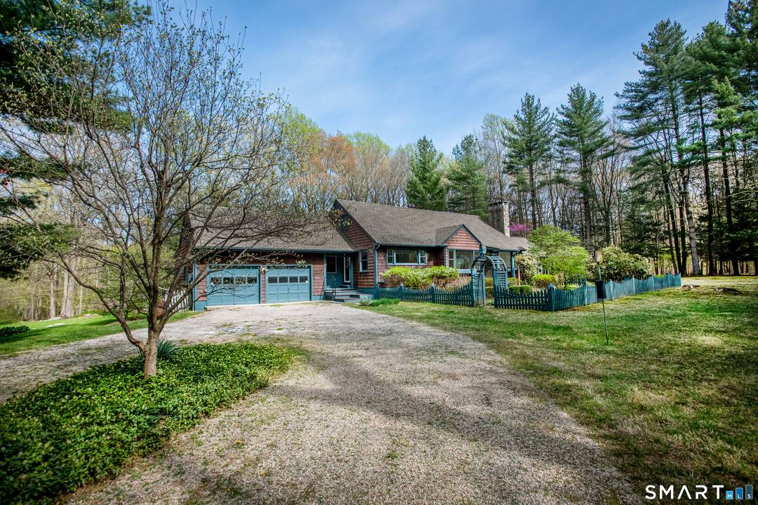 Tucked away, off the beaten path and down a quiet country lane, this charming 4 bedroom, 2.