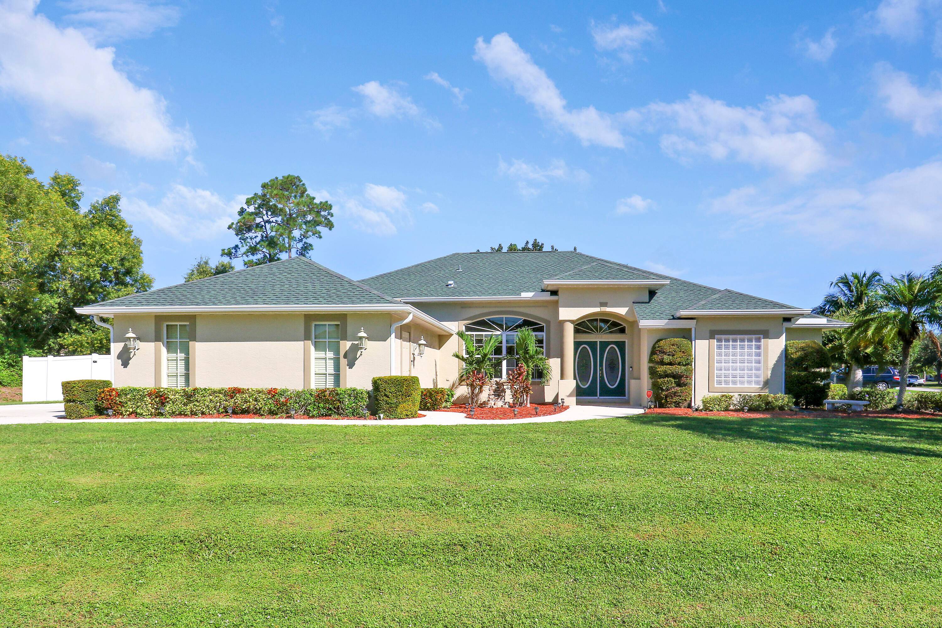 Beautiful 4 Bedroom, 2 Bath Custom Home on Nearly Half an Acre !