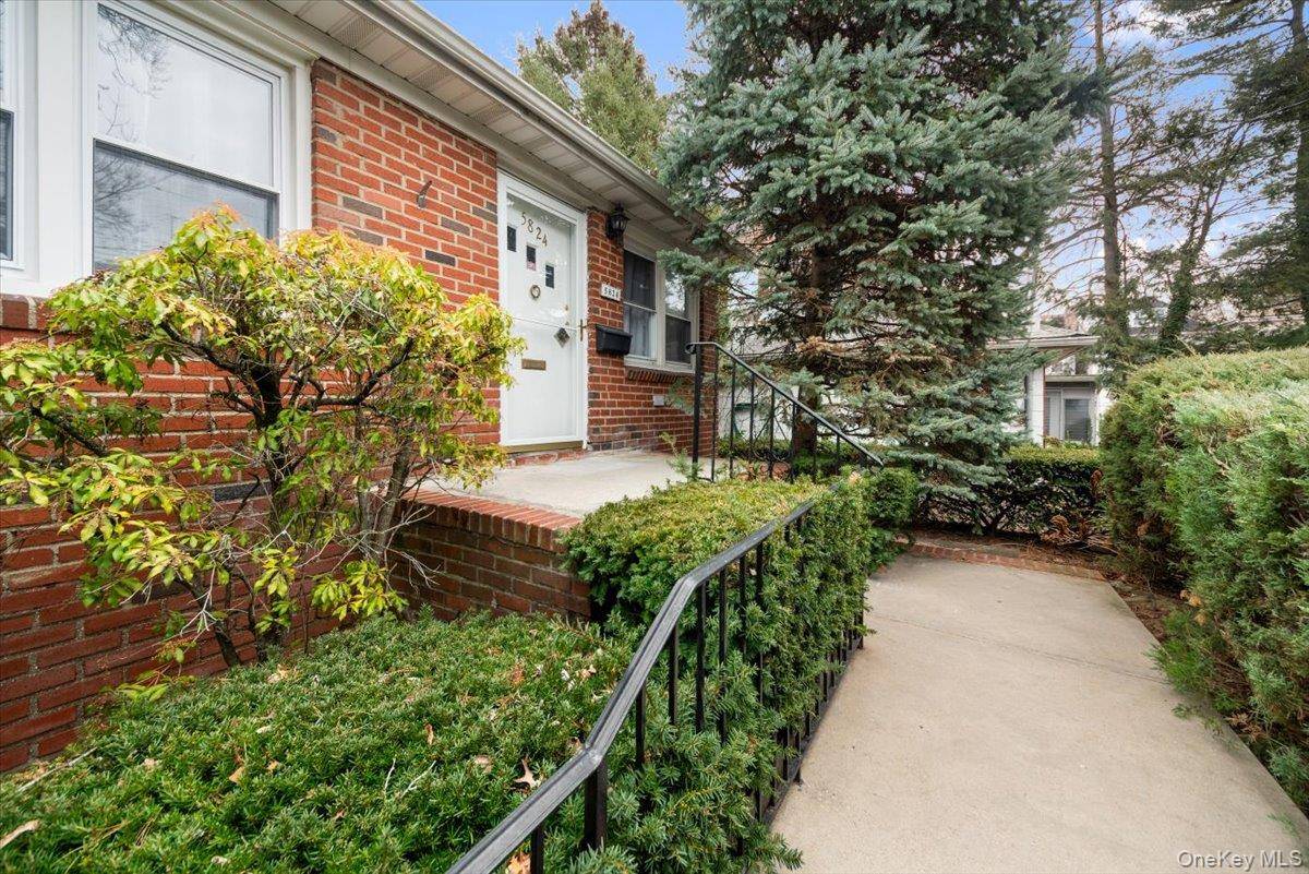 Inviting move in ready two family detached home featuring a separate detached garage and driveway, set on a beautifully manicured 59 x121 foot lot in North Riverdale.