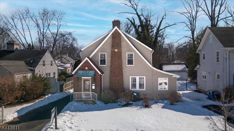 Four bedroom, 2. 5 bath Colonial located on a tree lined street.