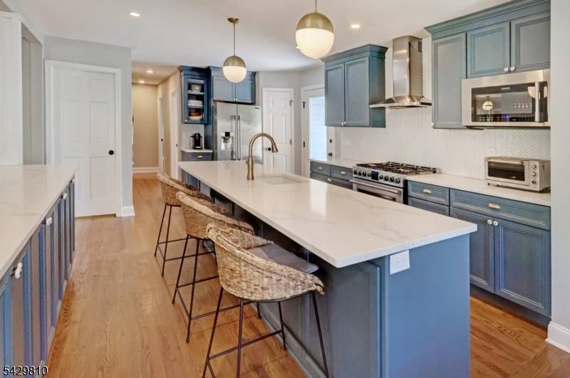 Move right into this beautifully maintained MULTIGENERATIONAL EXPANSIVE 5 6 BEDROOM, 3 BATH Colonial in the highly desirable St.