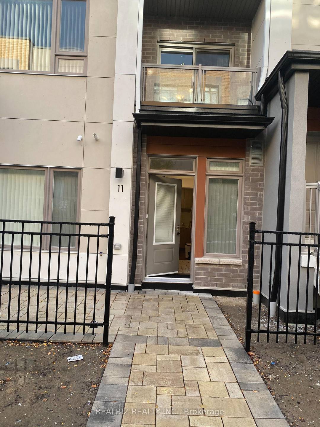Tastefully Furnished unit 1Br 1WR Townhome S S Fridge, S S Dishwasher, S S Stove With Hood Ensuite Laundry Private Patio Laminate Flooring In Living Room Kitchen.