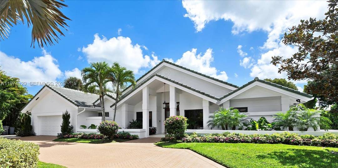 Tucked within the prestigious Mahogany Bend enclave of Boca West Country Club, this residence offers a rare opportunity to enjoy privacy, space, and the exceptional Boca West lifestyle.