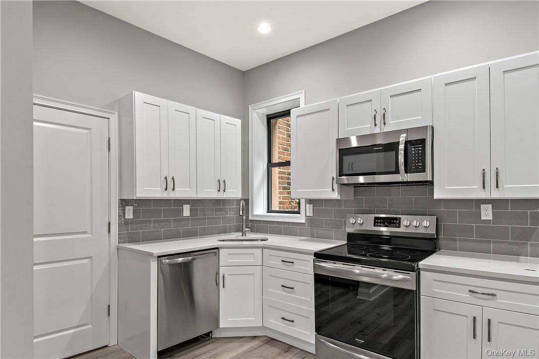 3 bedroom 2 full bath large eat in kitchen large living room and dining room laundry in unit, storage in unit.