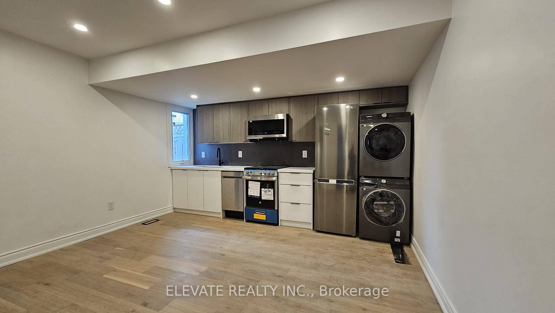 Step into this bright and spacious 2 bedroom unit featuring a sleek, modern kitchen with stainless steel appliances, quartz countertops, and ample cabinet space.