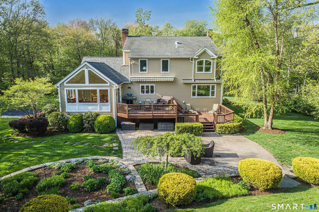 Classic Center Hall Colonial beautifully sited in one of Ridgefield's most sought after subdivisions offering exceptional amenities pool, tennis, clubhouse, recreation fields volleyball.