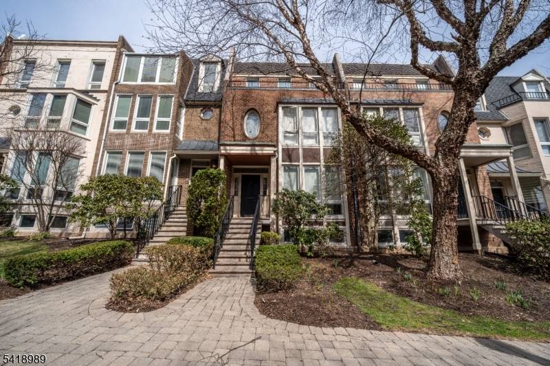 Spacious 4 bedroom, 4 bath townhouse offering 2, 734 sq ft across four levels in a gated community with a pool and clubhouse.