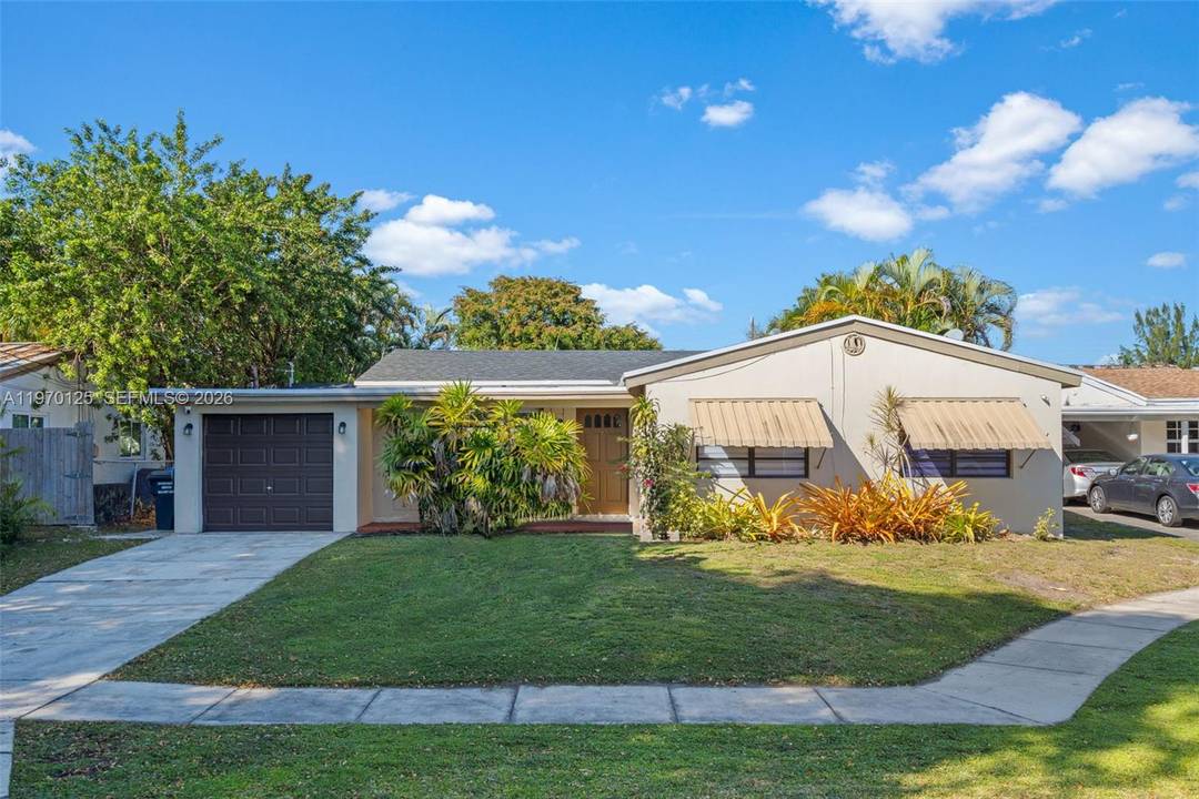Waterfront ranch home with pool and garage on cul de sac.