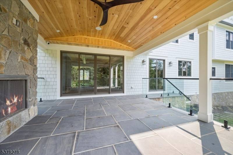 Welcome to 17 Hilltop Terrace, where impeccable design meets modern luxury in one of Chatham Township's most coveted locations.