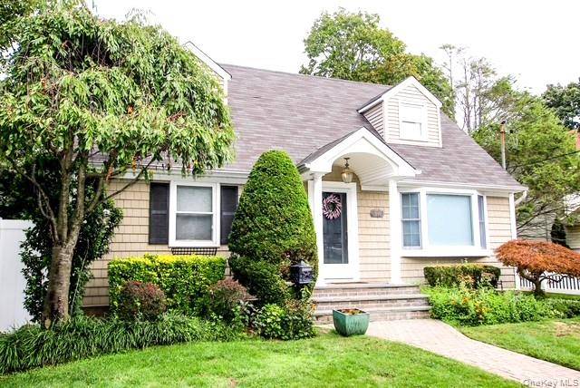 Welcome to this fabulous expanded Cape with rear dormer, perfectly set on an oversized 55x150 property.