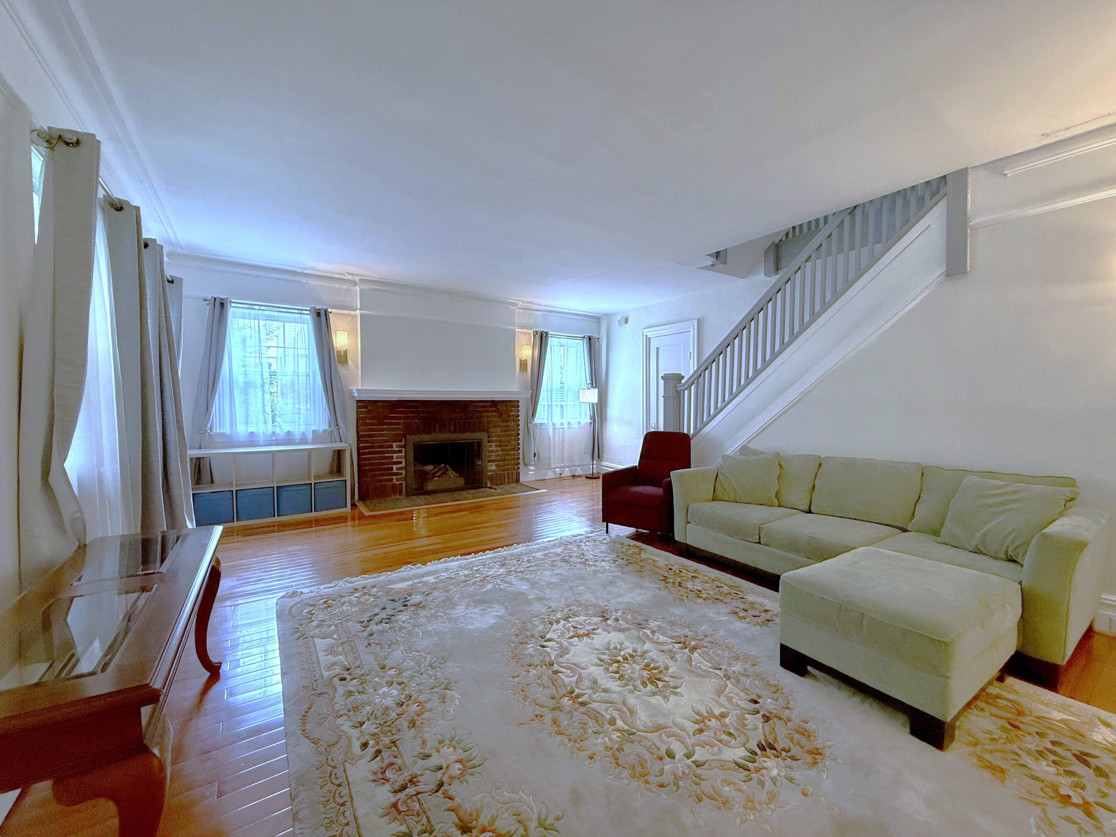 Expansive corner house features 5 generously sized bedrooms, 4 full bathrooms and 2 half bathrooms.