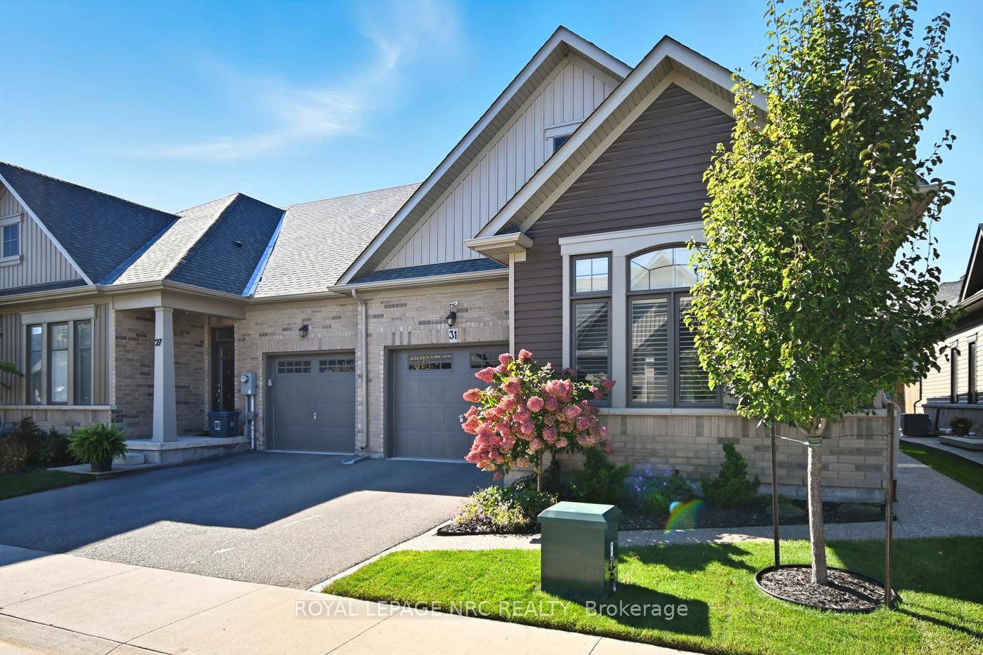 Remarkable bungalow townhome end unit with some well thought out upgrades !