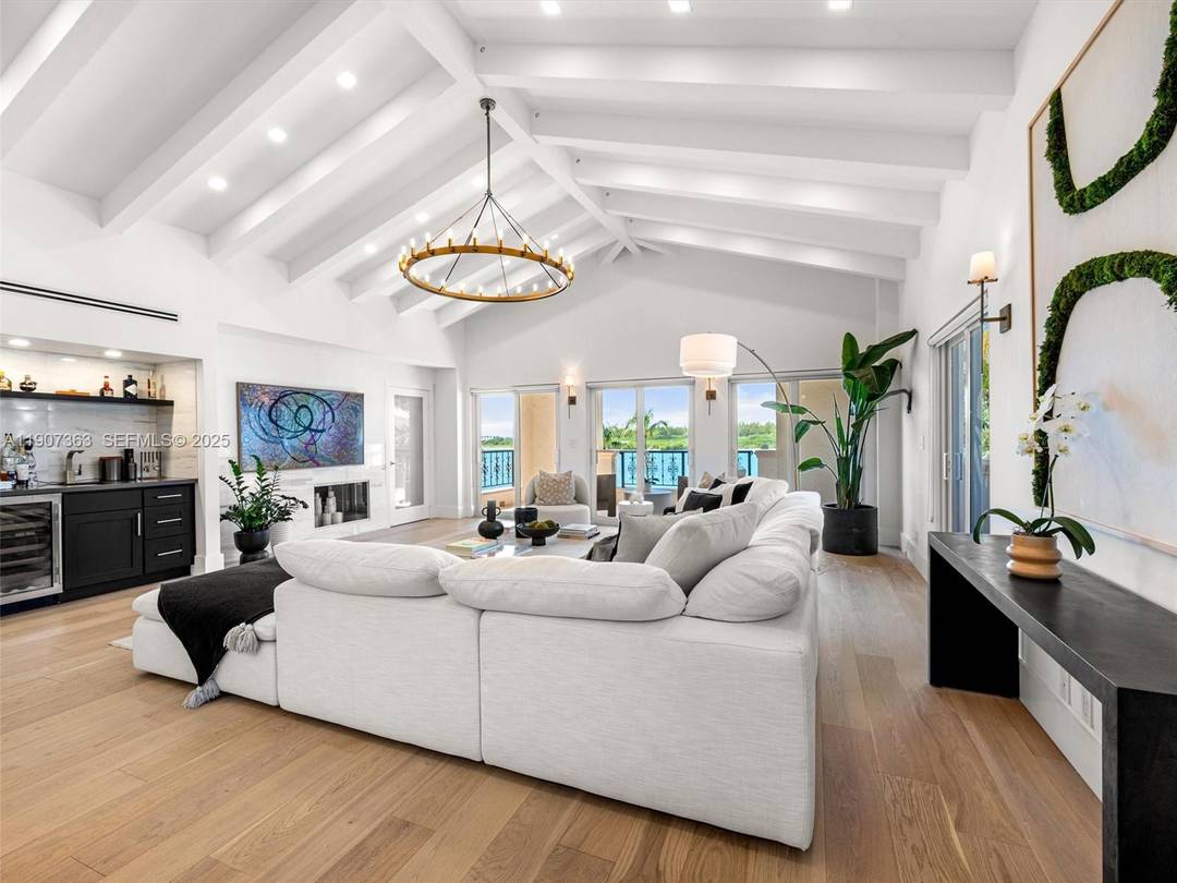 Step into luxury living in this fully renovated Bayside Village Penthouse on Fisher Island.