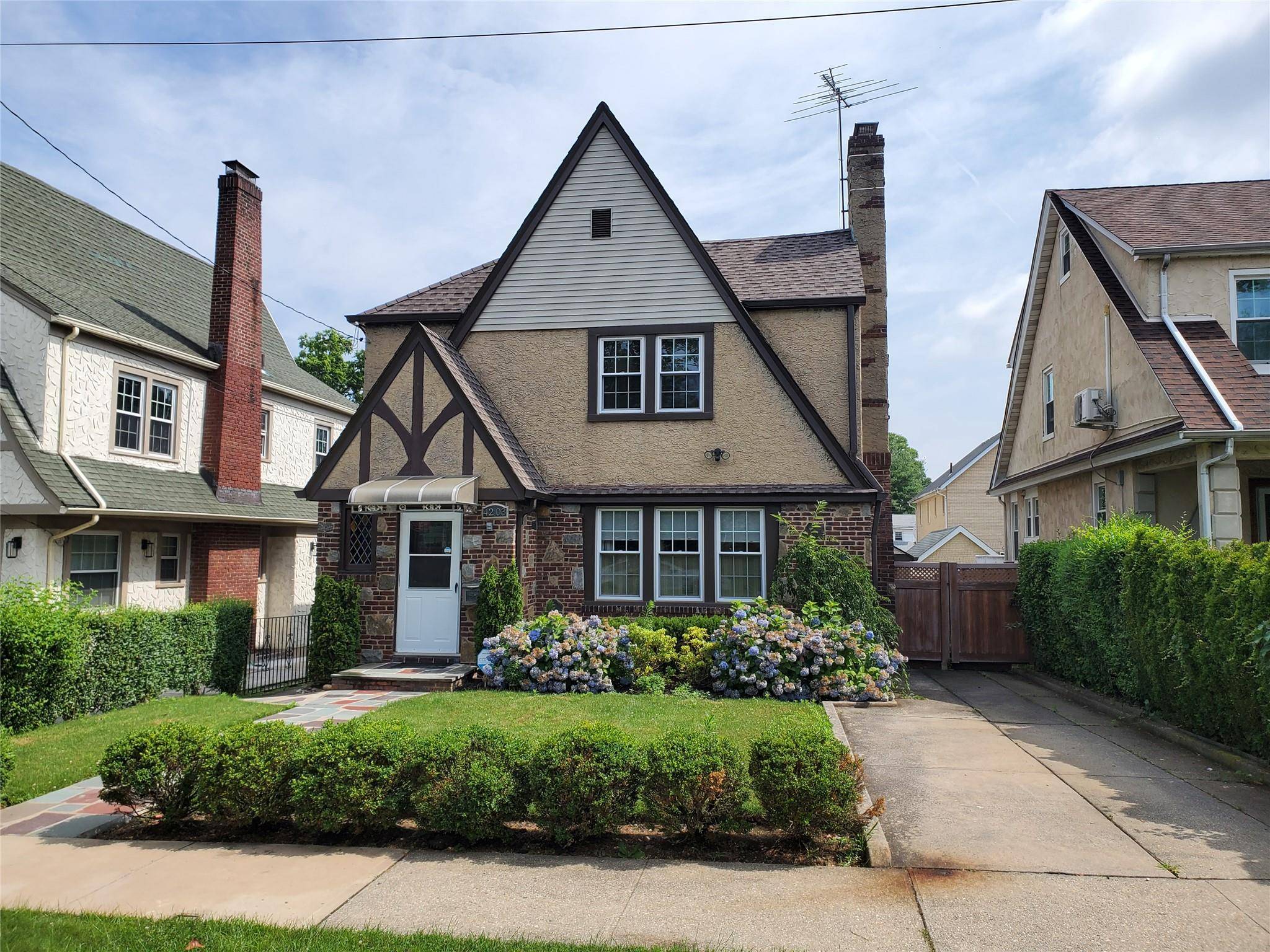 Spacious Brick and Stucco Tudor Colonial situated midblock on beautiful tree lined street within short distance to all that Little Neck has to offer.