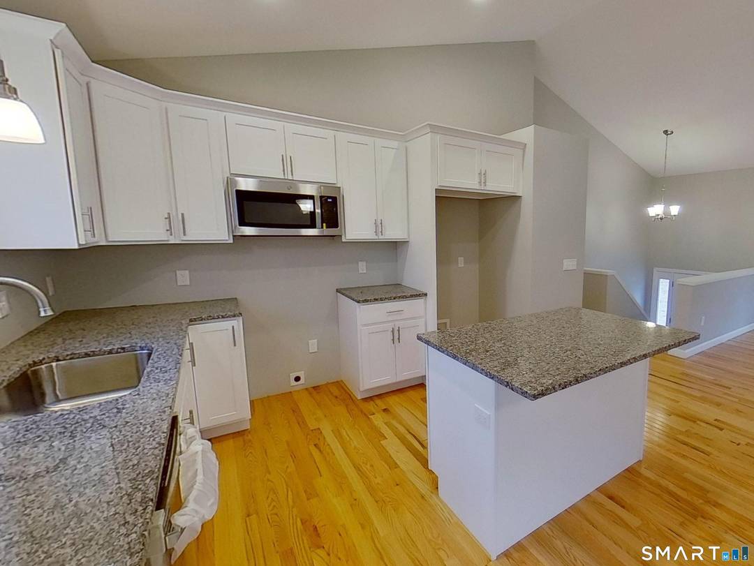 Construction has begun on this New Contemporary Raised Ranch on a Beautiful Wooded Lot.