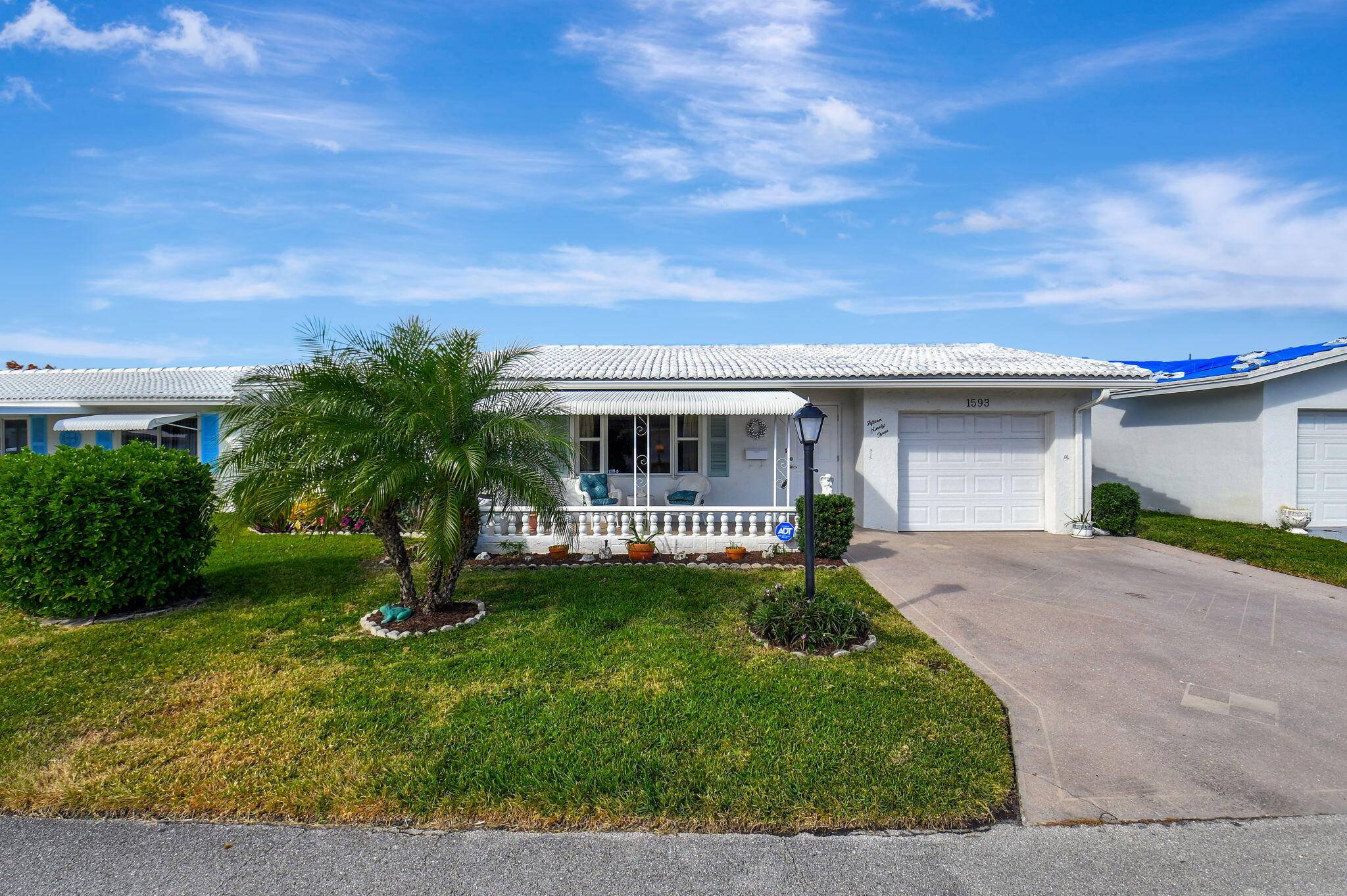 This charming Challenger model home features 2 bedrooms, 2 bathrooms, and a versatile office extra bedroom space, perfectly suited for the active 55 community of Palm Beach Leisureville.