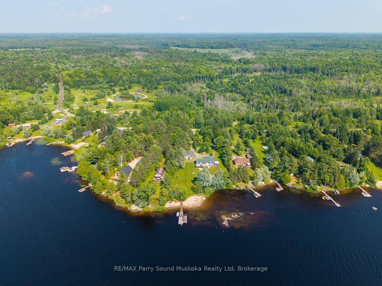 Western exposure open concept Viceroy lake house on a four season road enjoying private panoramic views over Whitestone Lake.