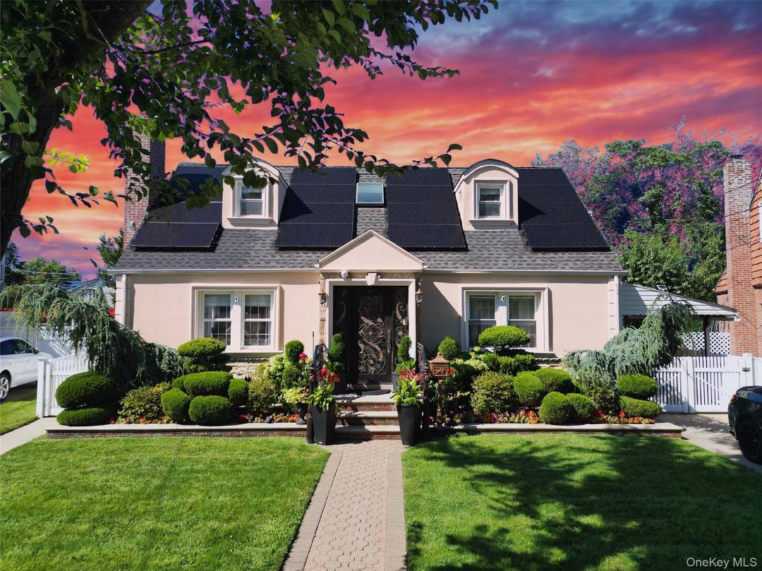 Welcome to 14 Plymouth Street, a wide lined cape in the Manor Oaks section of New Hyde Park.