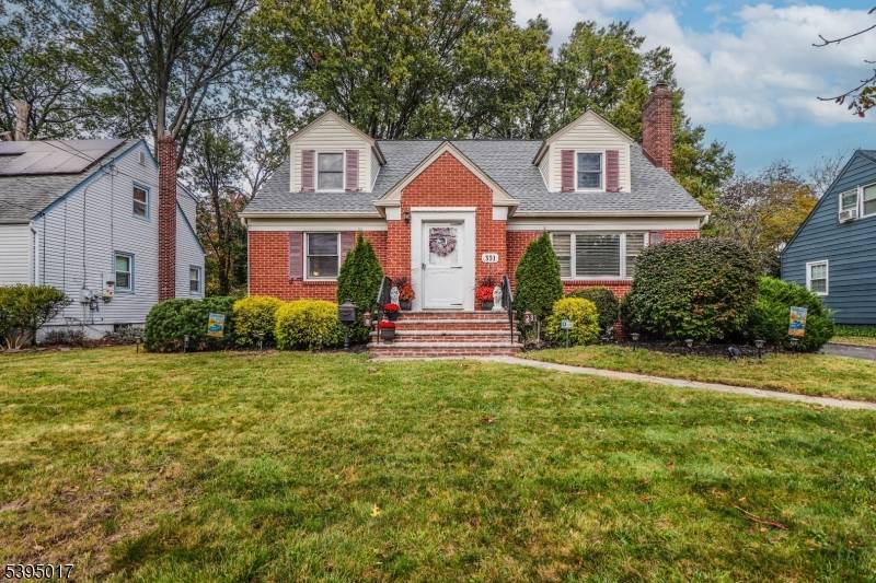 Pride of ownership shows inside and out of this spacious custom Cape in pristine condition.