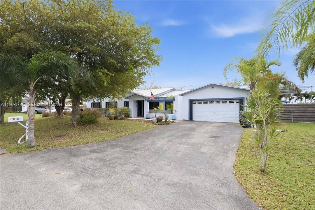 Spacious 4 bedroom, 3 bath home featuring a durable metal roof and solid overall condition.