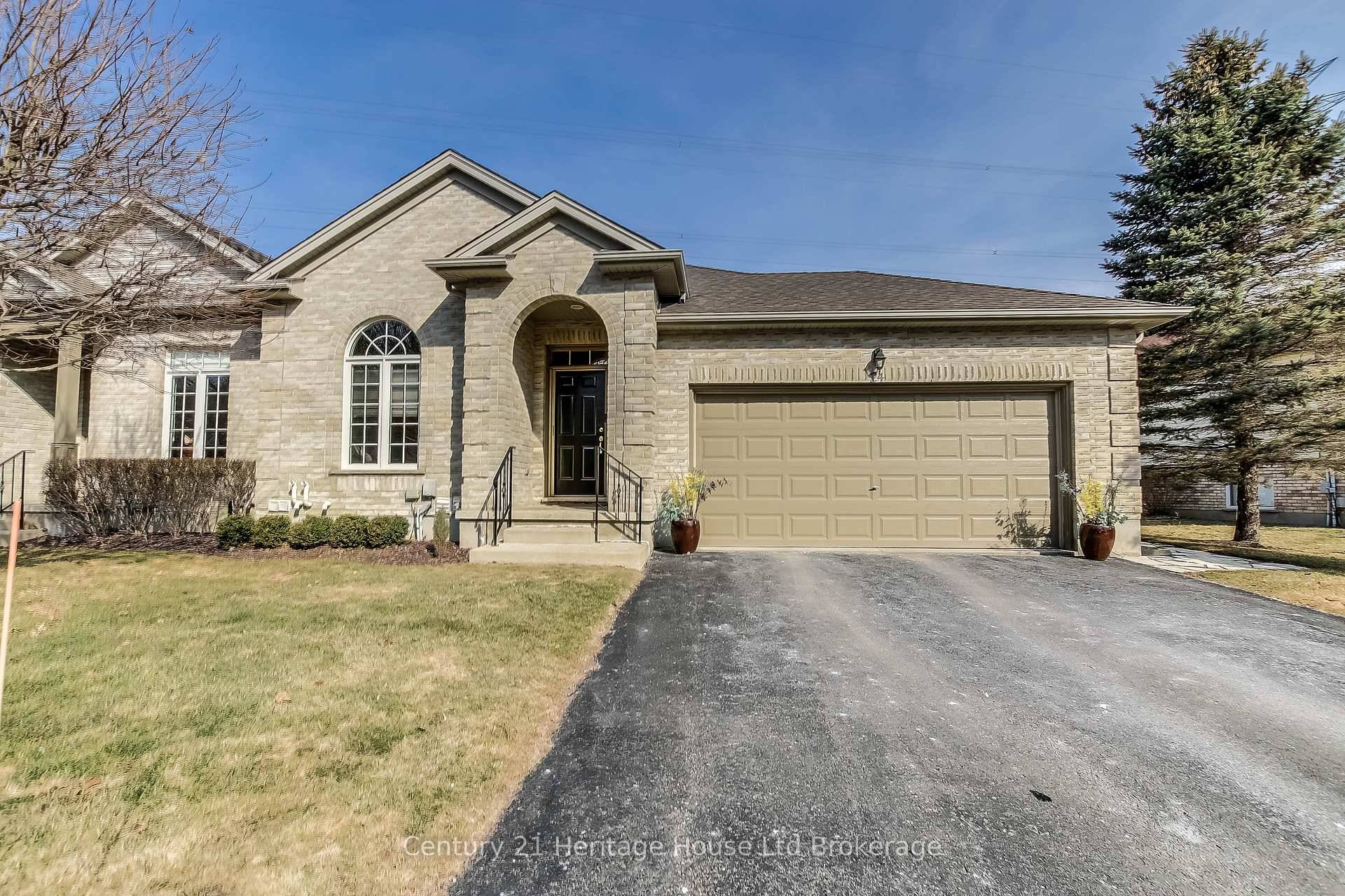 Welcome to carefree living in this beautiful end unit condo in a quiet enclave in north St.