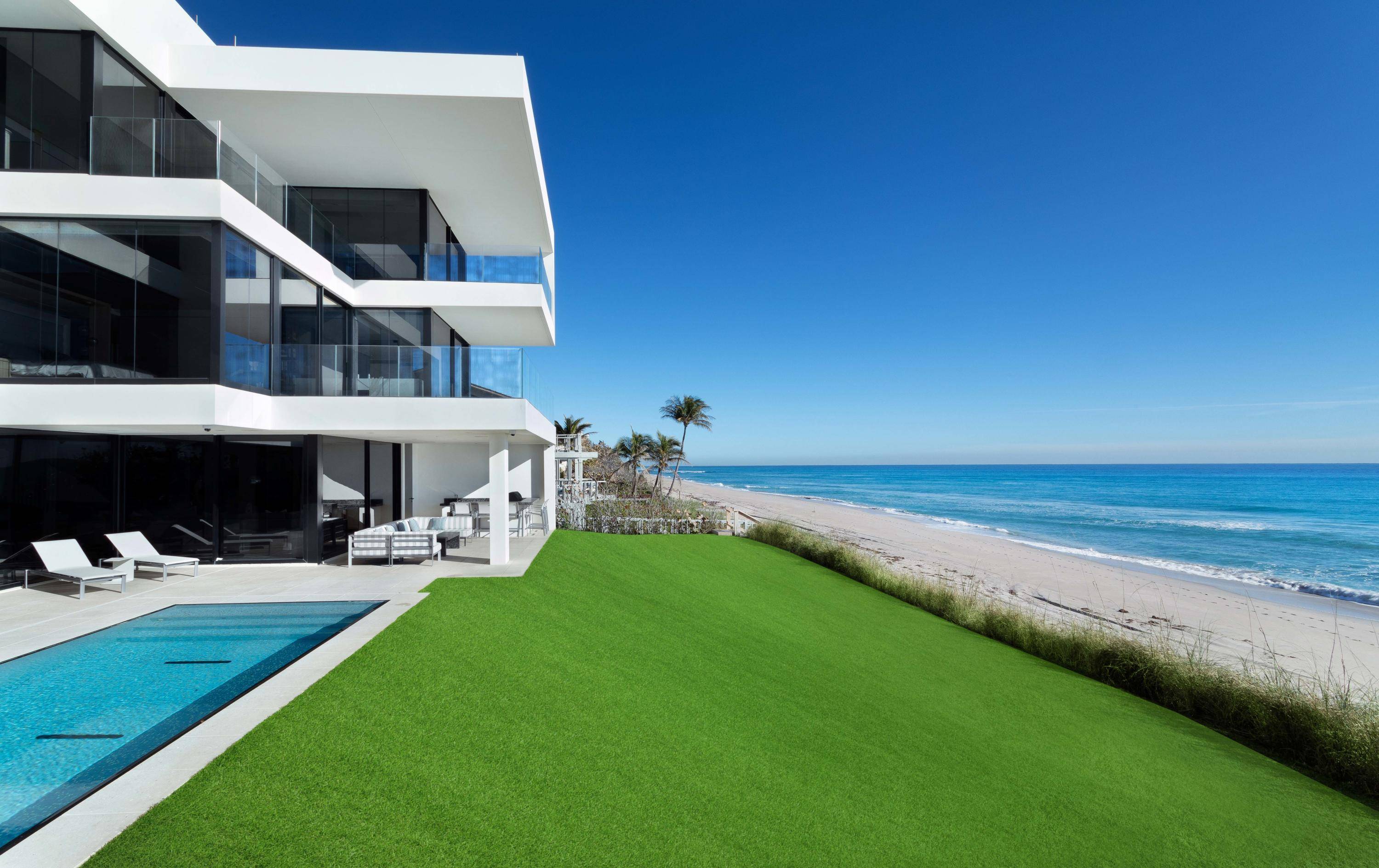 THE BEACH HOUSE A Gated Modern Malibu inspired Ocean To Intracoastal Estate sited on 2.