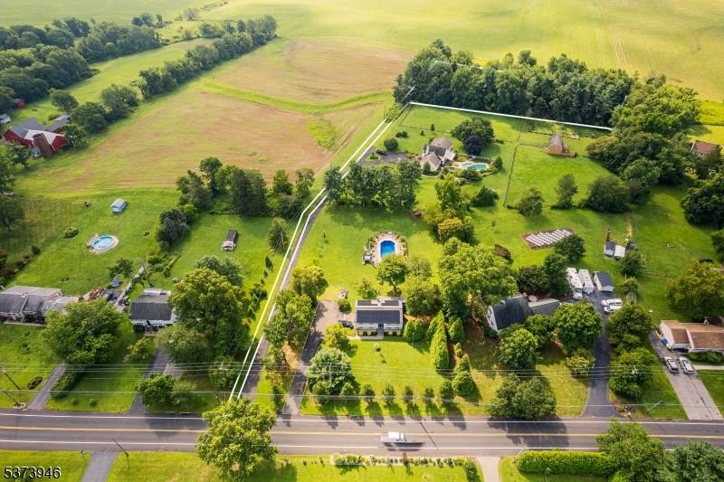 Discover 3. 3 acres of opportunity in Hillsborough's sought after Clover Hill section.