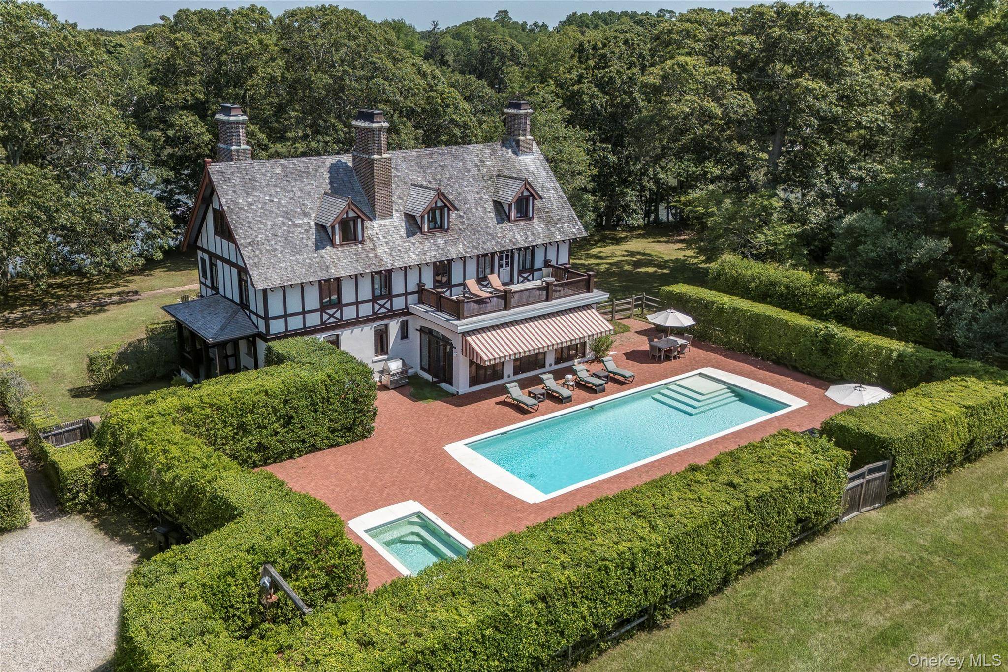 A Rare Shelter Island Gem with Timeless Soul Welcome to a truly extraordinary waterfront estate where history, elegance, and coastal luxury converge.
