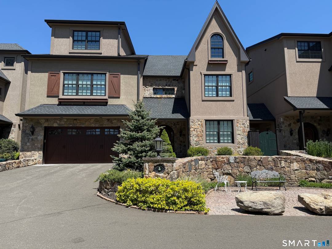 One of five Luxury Townhouse Condominiums, NESTLED PRIVATELY BEHIND 2614 BOSTON POST ROAD and a short drive to Guilford's Town Center, the Cottages at the Woods transports you to a ...