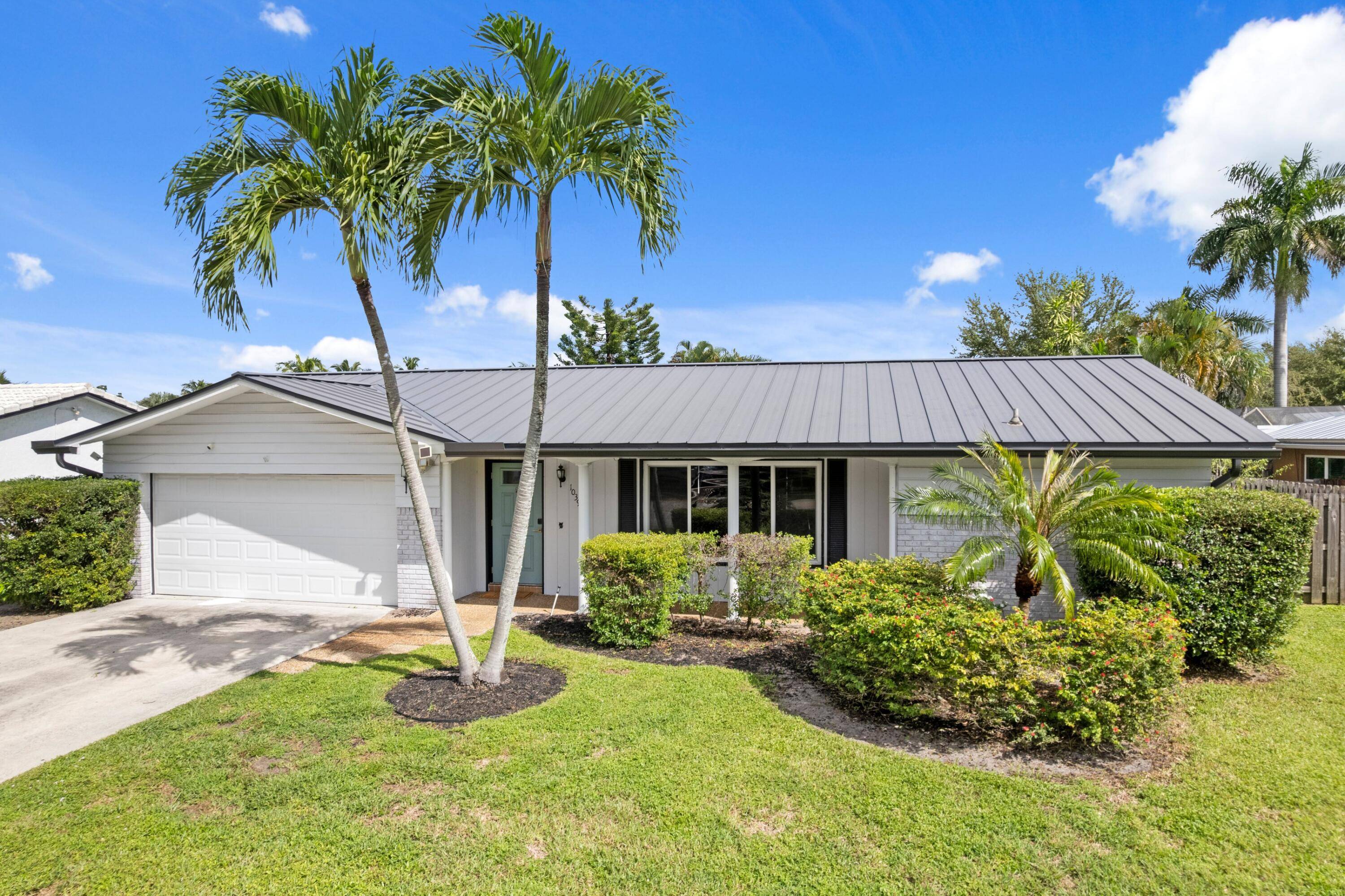 Welcome to this meticulously updated 3 bedroom, 2 bathroom pool home, perfectly situated in East Boca and offering unparalleled convenience to everything you desire.