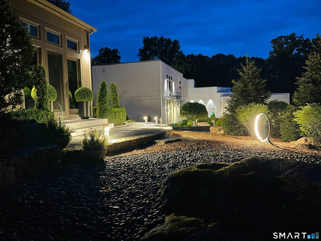A rare offering distinguished by architectural clarity, complete privacy, and a deeply personal design vision, set within one of Fairfield County's most sought after locations.