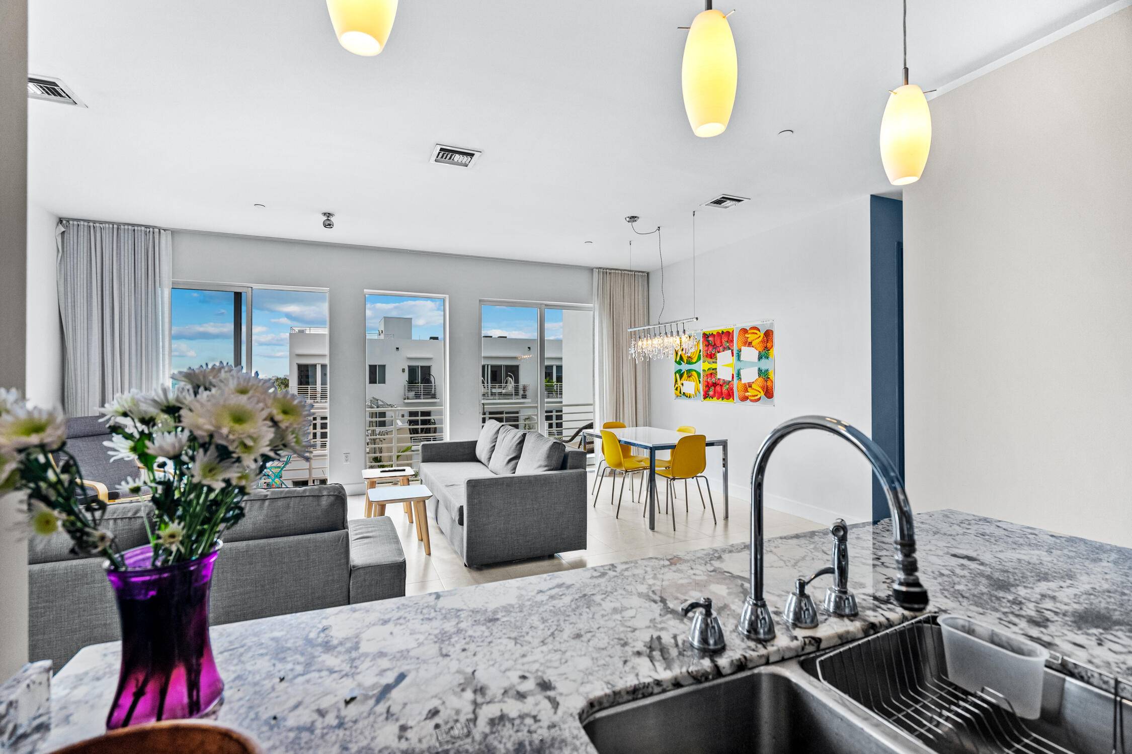 Modern 2BR 2BA corner penthouse in the heart of downtown Delray Beach, directly across from the upcoming Sundy Village.