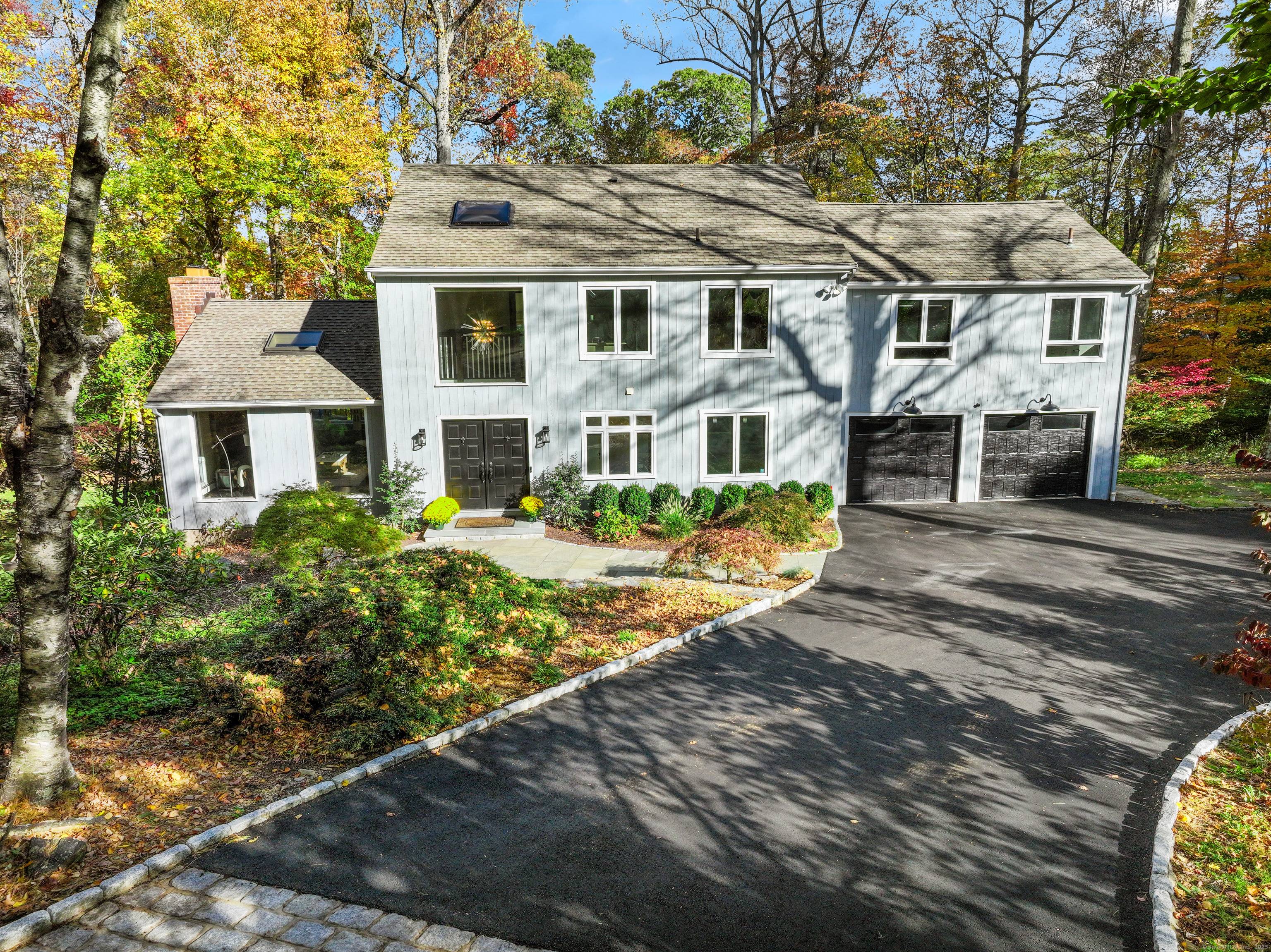 This 4, 400 sq ft house sits on an expansive 1 acre parcel in central Westport.