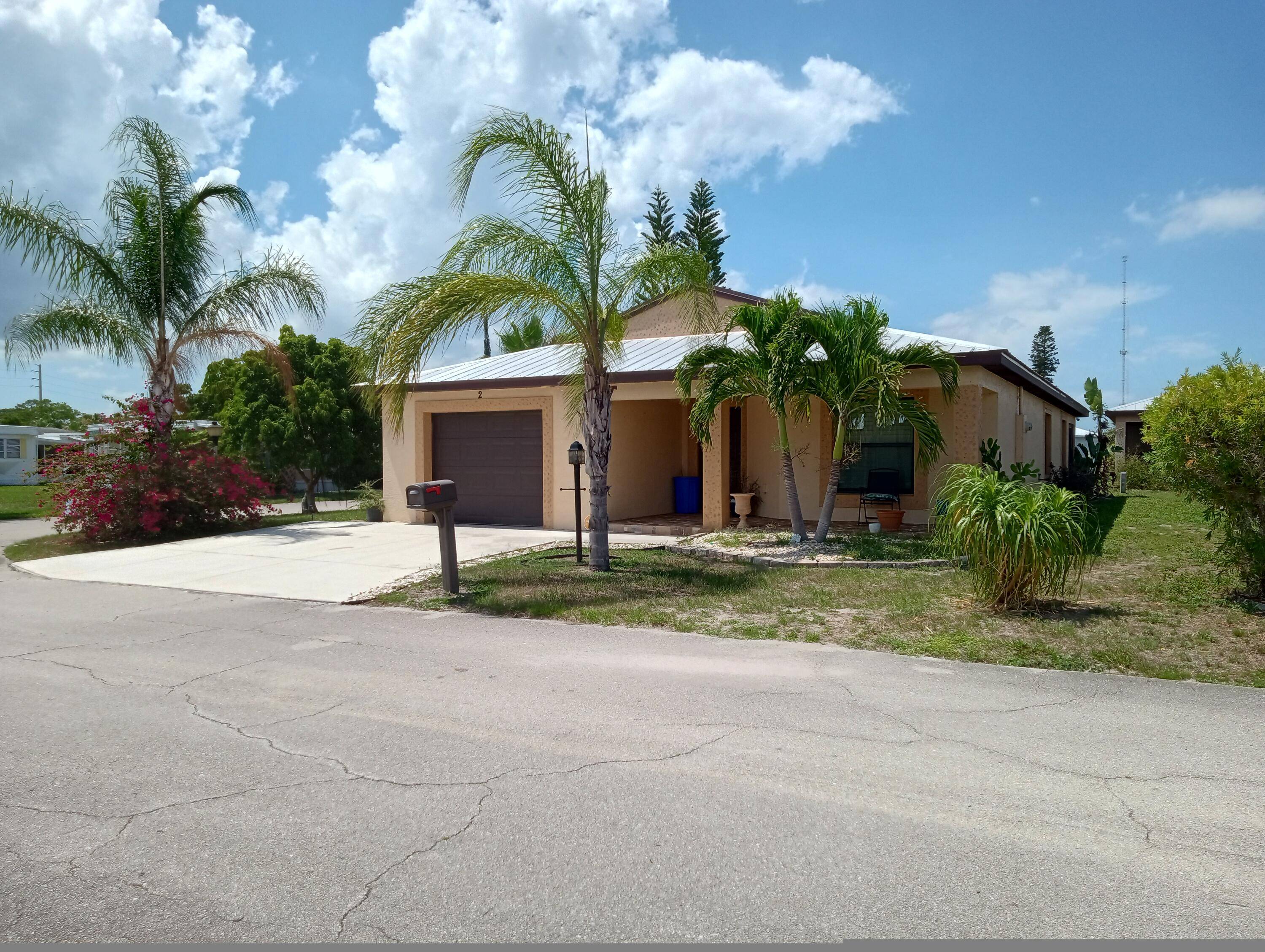 Beautiful corner lot 2 bedroom 2 bath home located in the 55 community of Spanish Lakes Enjoy your mornings or afternoons sitting out in the enclosed back porch.