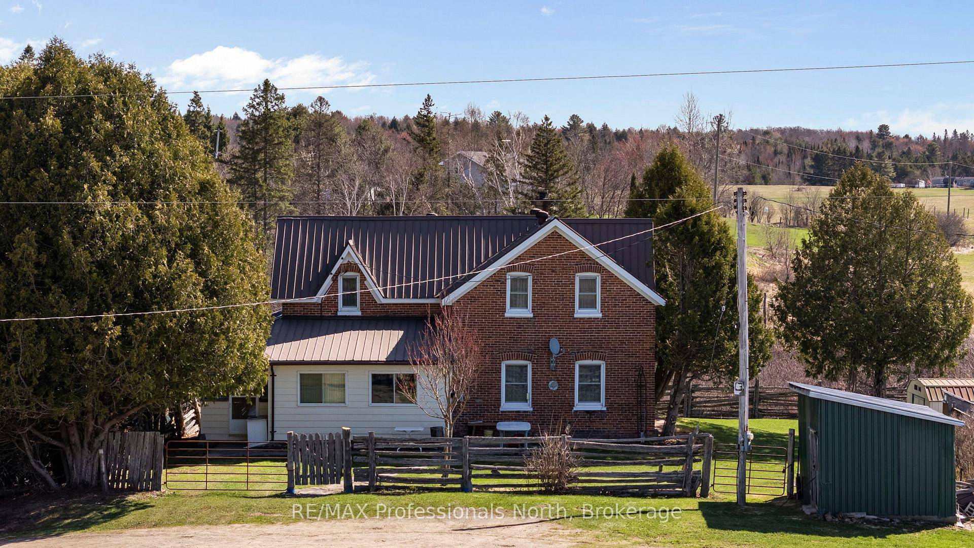 Step back in time to a simpler era with this enchanting 100 year old red brick farmhouse, nestled amidst rolling hills and whispering hayfields.