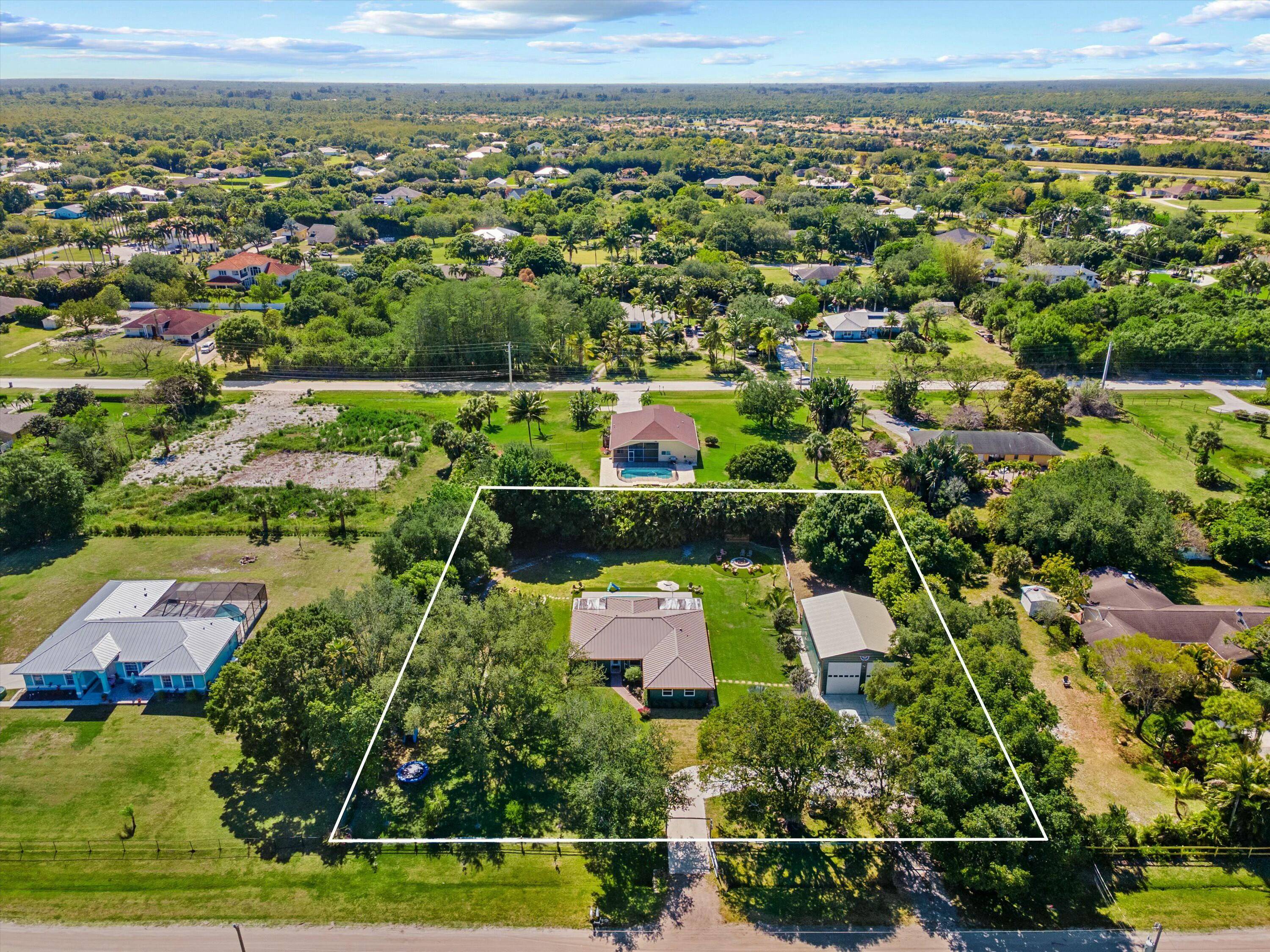 Experience country living at its finest with this charming 4 bedroom 2 bathroom farmhouse nestled on 1.