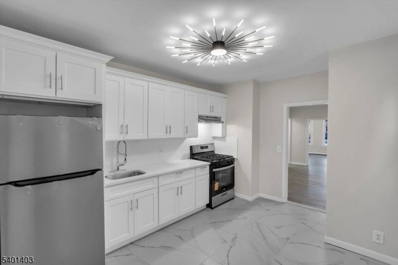 Welcome to this oversized two family home located at 537 N Grove Street, East Orange fully vacant and move in ready, offering exceptional space, flexibility, and long term value.