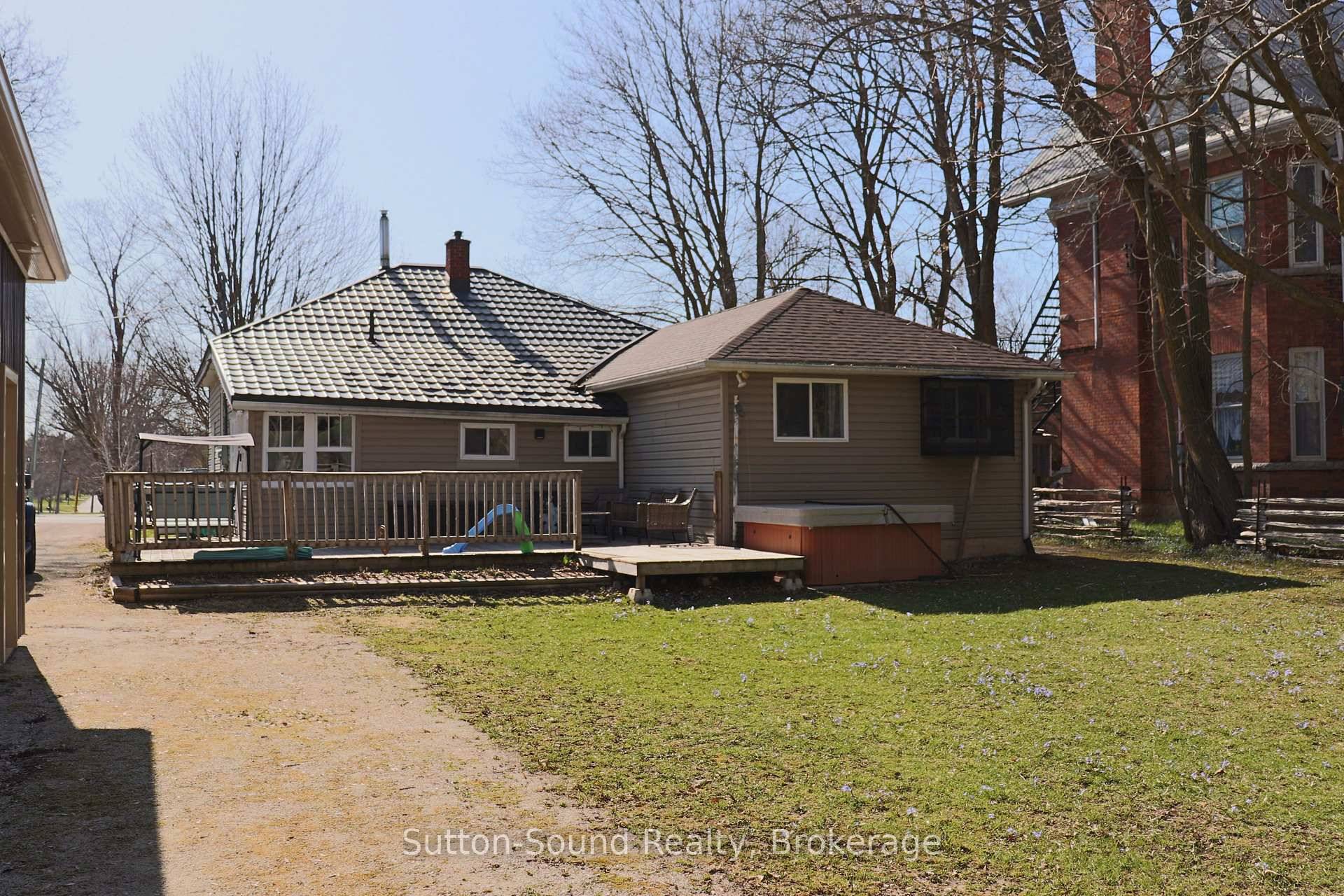 Charming 3 Bedroom Bungalow with Heated Workshop in Quiet Small Town Setting !