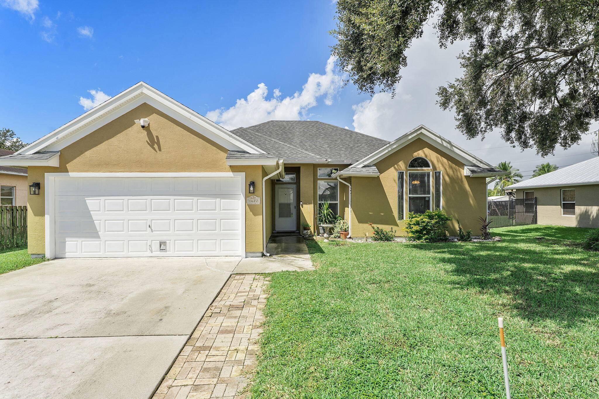 Completely remodeled 3 bedroom, 2 bath home in Port Saint Lucie with everything already done new roof 2022, brand new water heater 2025, and upgraded electrical panel.