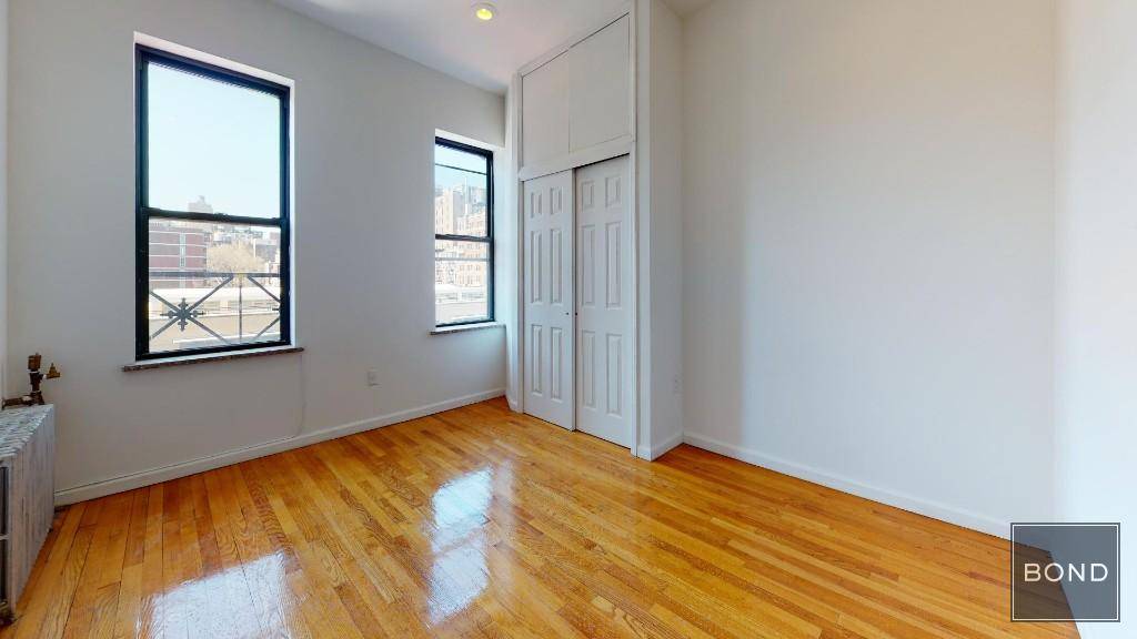 Large 2 bedroom railroad apartment in prime East Village location !