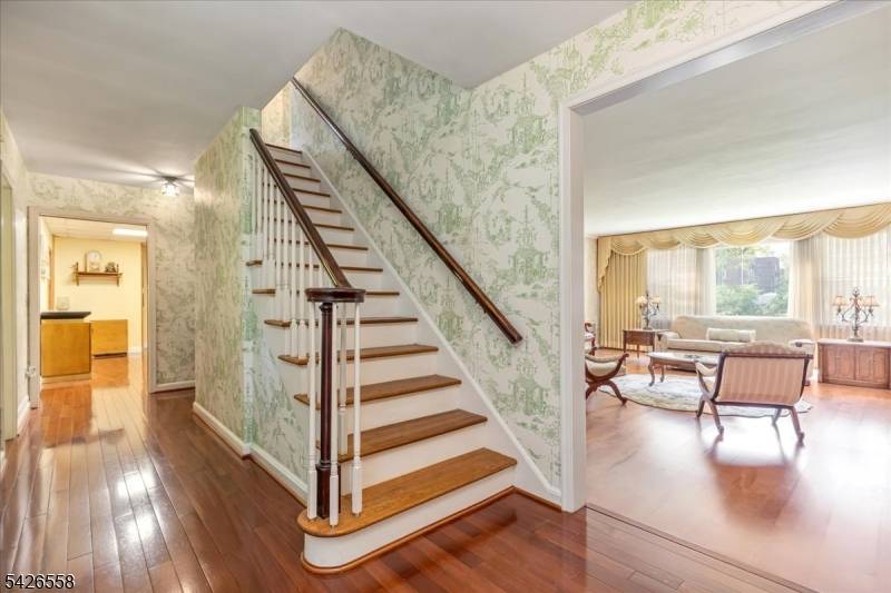 Nestled in the sought after Van Wyck Brooks section of Plainfield, once known as Presidential Way, this expansive raised and extended ranch sits on approximately 1.
