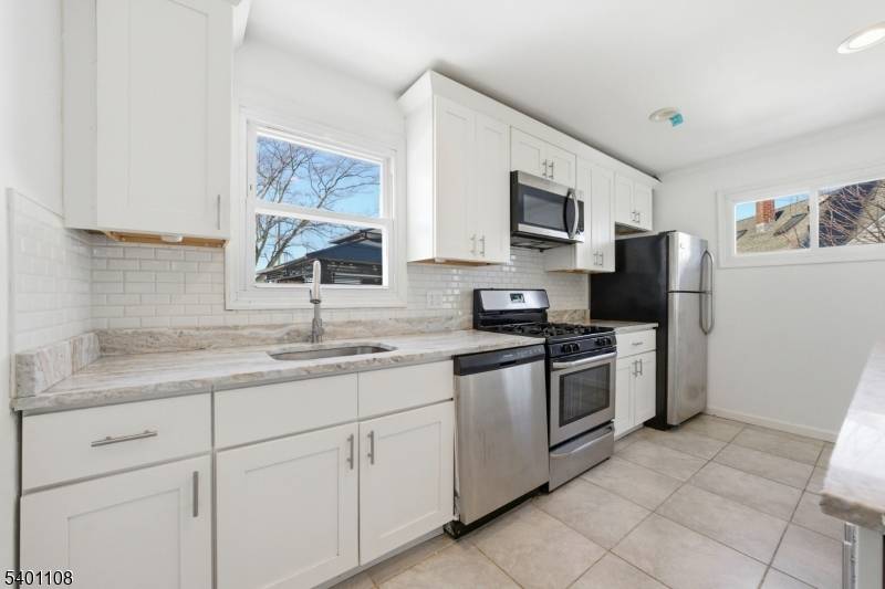 Improved Price. Charming light filled Cape with fresh paint, modern updates and flexible floor plan ready for your next chapter.